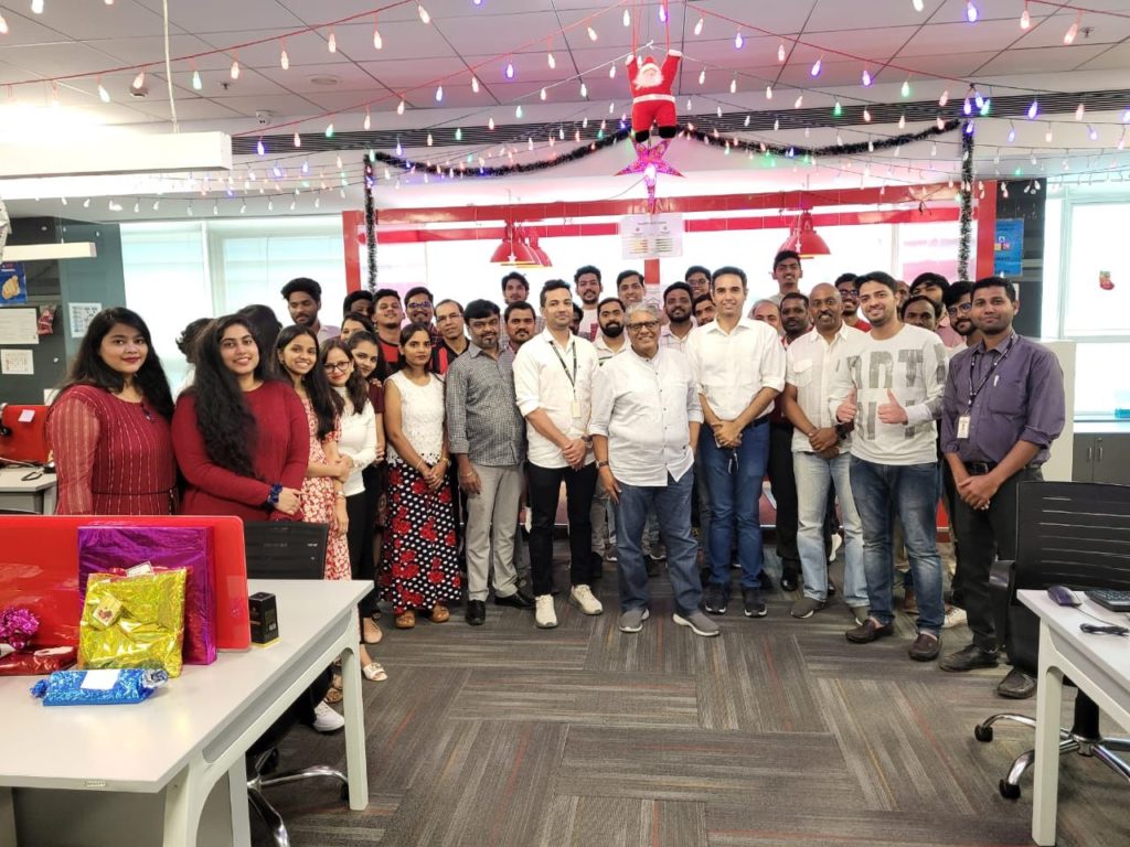 Employees at JR Technologies posing with chairman and founder of JR Technologies- Mr. Arvin Shah.  It features on the employee engagement page of the company JR Technologies. The company provides innovative business solutions in the travel landscape and beyond.