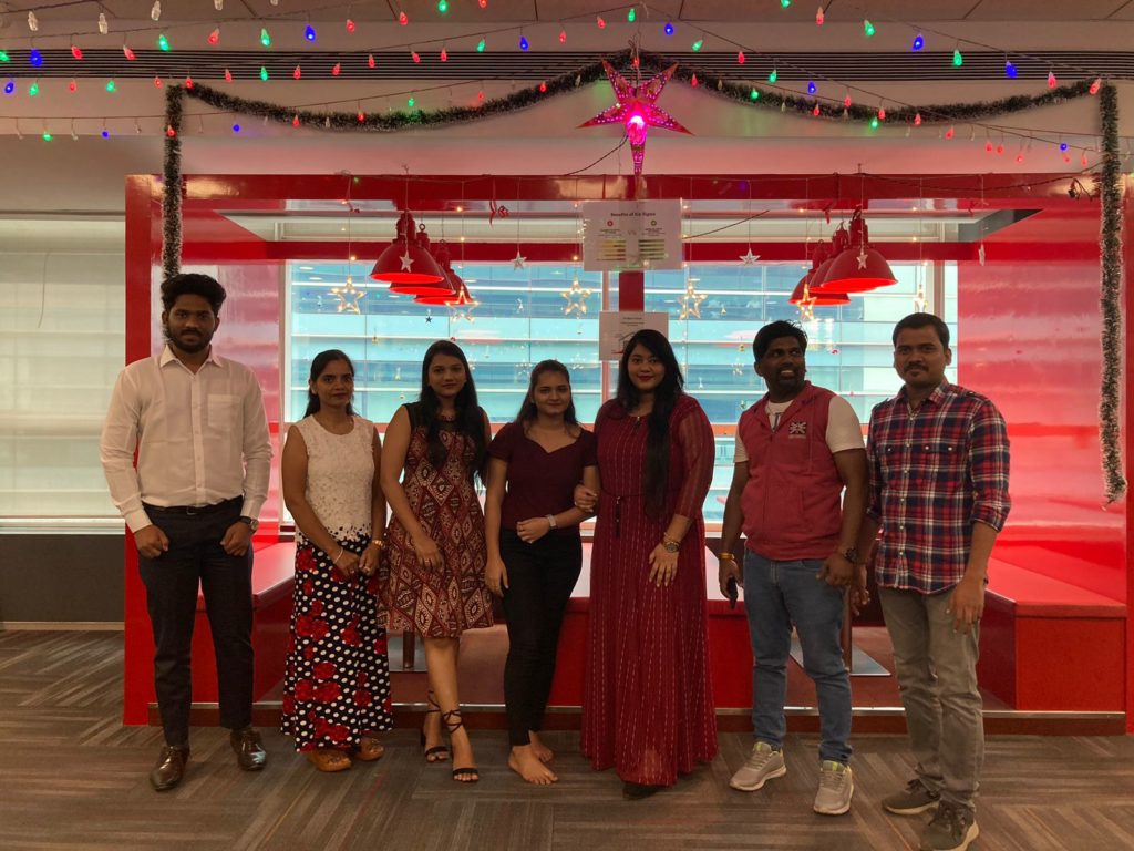 Group of Employees at JR Technologies posing together for Christmas celebrations at the office. It features on the employee engagement page of the company JR Technologies. The company provides innovative business solutions in the travel landscape and beyond.