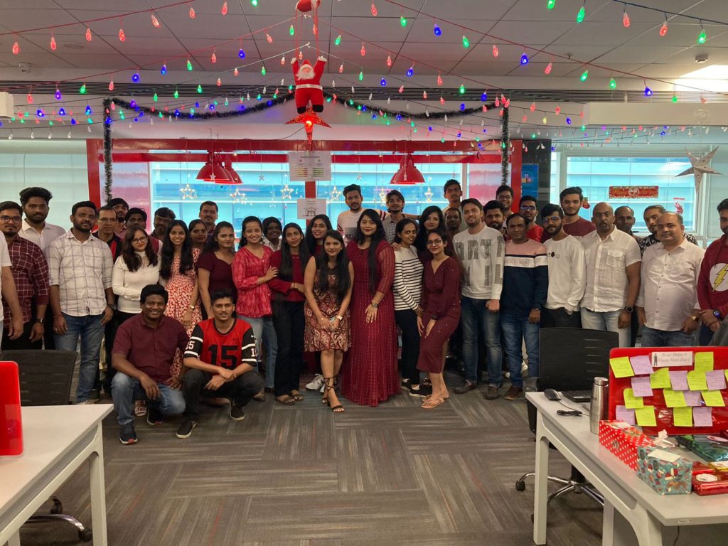 Employees at JR Technologies posing together for Christmas celebrations at the office. It features on the employee engagement page of the company JR Technologies. The company provides innovative business solutions in the travel landscape and beyond.