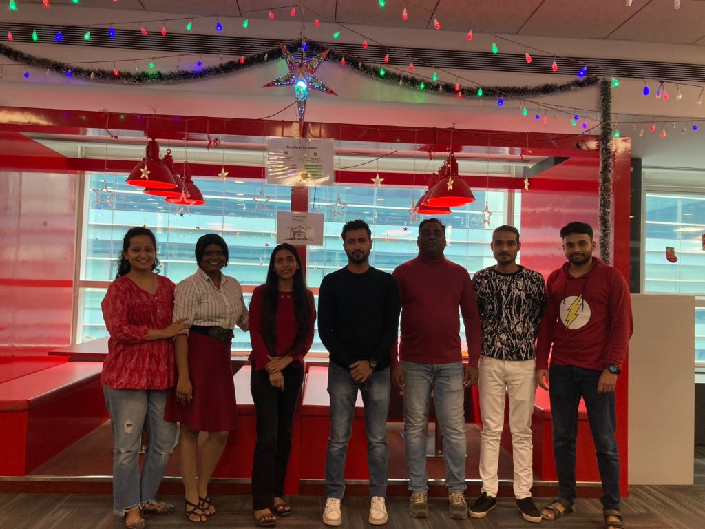 Picture of the Employees at JR Technologies posing together for Christmas celebrations at the office. It features on the employee engagement page of the company JR Technologies. The company provides innovative business solutions in the travel landscape and beyond.