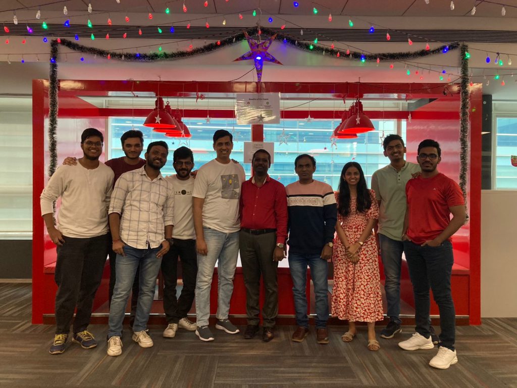 Image of the Employees at JR Technologies posing together for Christmas party at the office. It features on the employee engagement page of the company JR Technologies. The company provides innovative business solutions in the travel landscape and beyond.