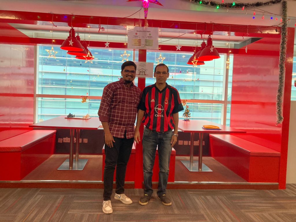 Two Employees at JR Technologies posing together for Christmas celebrations at the office. It features on the employee engagement page of the company JR Technologies. The company provides innovative business solutions in the travel landscape and beyond.