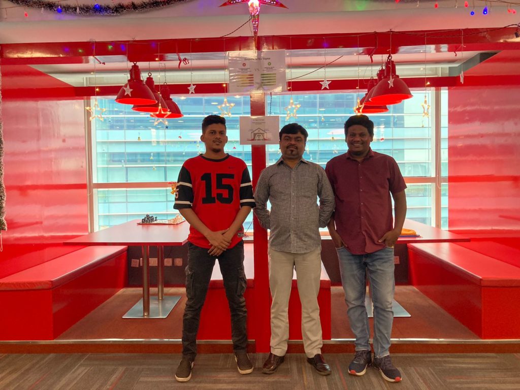 Three Employees at JR Technologies posing together for Christmas celebrations at the office. It features on the employee engagement page of the company JR Technologies. The company provides innovative business solutions in the travel landscape and beyond.