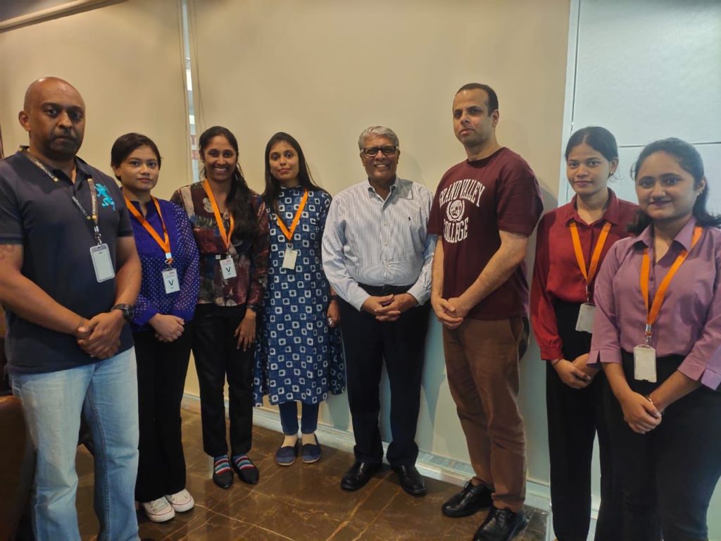 Picture of JR Technologies employees talking with the students of the Air Ticketing Management course during an industrial visit. It features on the Training Page of the company JR Technologies.