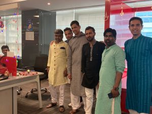 Employees at JR Technologies posing together for Diwali party at the office. It features on the employee engagement page of the company JR Technologies. The company provides innovative business solutions in the travel landscape and beyond.